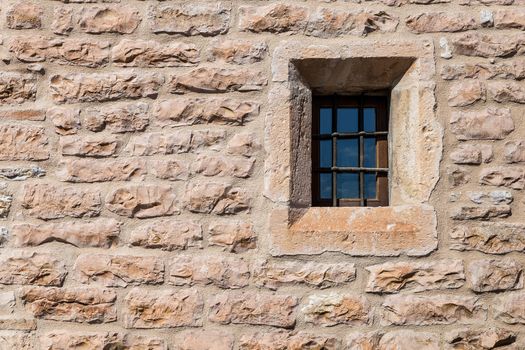 Assisi (Italy): Window on medieval stone wall