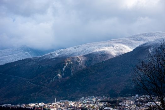 View to the mountain Uludag covered in the snow with city of Bursa benethe it
