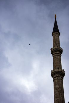 the minaret of the one famous istanbul mosque and the dark sky