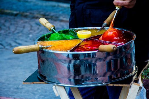 Man is selling Osmanli macunu candies on the street