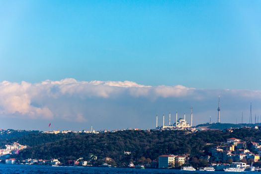 looking to the Camlica hill from the sea while sun is shining the new Republic Mosque