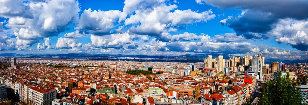 Panoramic view with dramatic coulds and sky from city of Bursa in Turkey