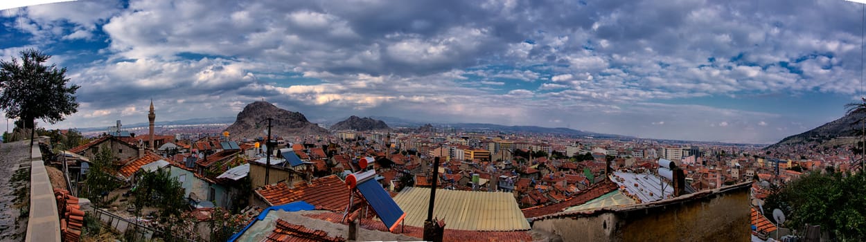 Panoramic view with dramatic coulds and sky from city of Afyon in Turkey