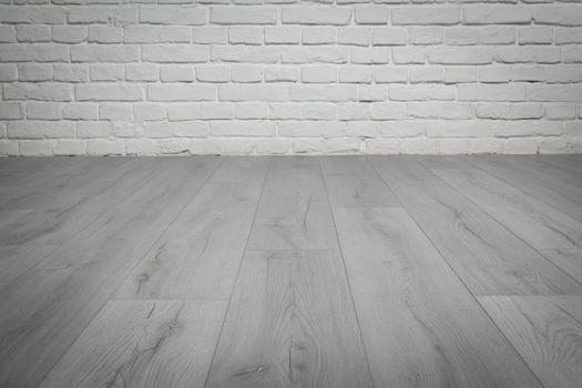 Old white brick wall and grey wood floor background