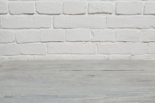 Old white brick wall and white wood floor background