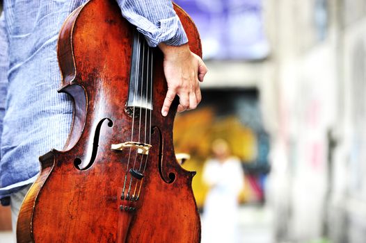 Close up view of musician holding cello instrument
