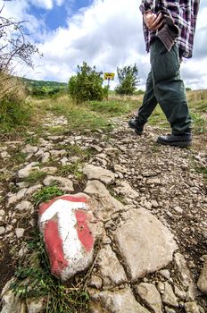 Hiking path and sign near mountain peak