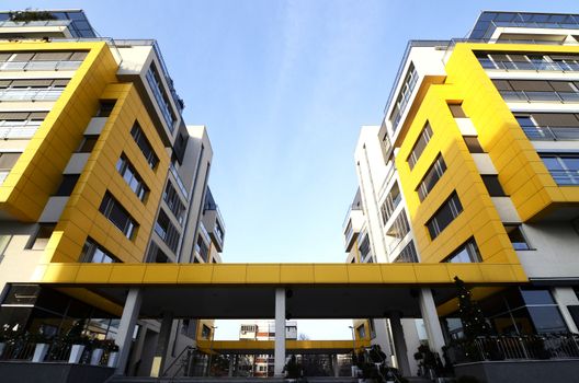 Details of a modern yellow building on sunny day