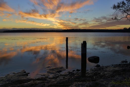 Tranquility at sunset with reflections in teh still waters
