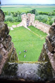 Old damaged brick castle on cloudy day