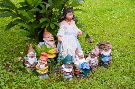 White snow and the seven dwarfs on a lawn of the Tyrol in Austria