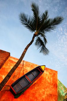 Colorful view on palm tree and boat