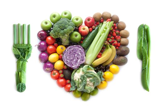 Fork and knife made from vegetables with heart shape fruits and vegetables as a meal