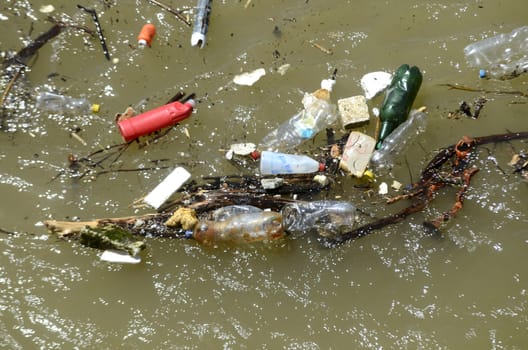 Close up view on Garbage in the polluted river