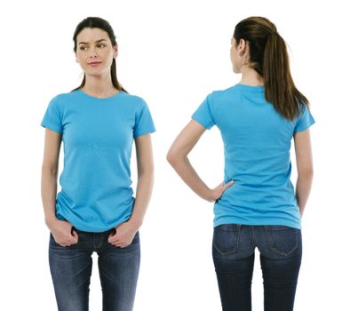 Photo of a beautiful brunette woman posing with a blank light blue t-shirt, ready for your artwork or design.