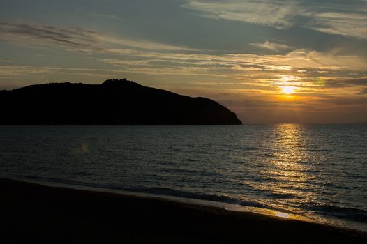 a beautiful view of the baratti gulf at sunset