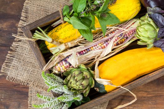 Fresh organic vegetables wooden floor with copy space. Green, yellow and multicolor vegetables background. Healthy eating background. Vegetarian food, organic food.