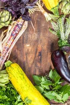 Fresh organic vegetables wooden floor with copy space. Green, yellow and multicolor vegetables background. Healthy eating background. Vegetarian food, organic food.