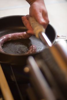 Close up of process of making homemade sausage at home with pressure machine