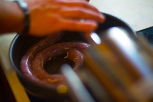 Close up of process of making homemade sausage at home with pressure machine