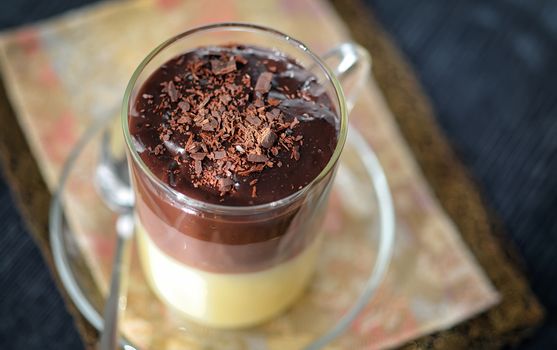 Triple chocolate layer mousse cake on vintage table