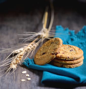 Oatmeal cookies isolated on wooden table