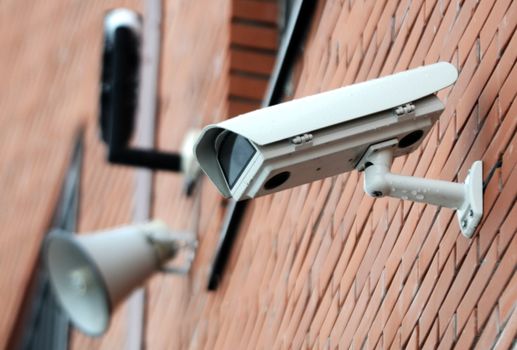 Security camera and alarm horn on the wall
