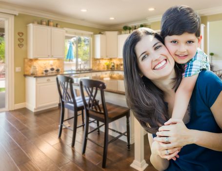 Young Mother and Son Inside Beautiful Custom Kitchen.