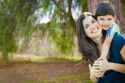 Young Mother and Son Portrait Outdoors.