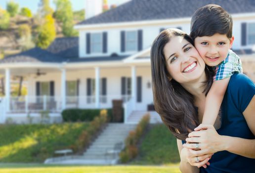 Young Mother and Son In Front Yard of Beautiful Custom House.