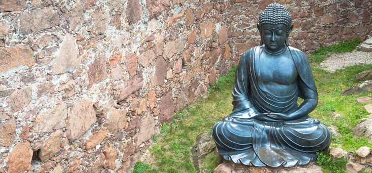 Meditating Buddha Statue, made of bronze. 19th Century, sitting stance, useful copyspace.