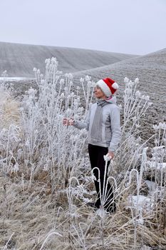 Middle age woman in winter landscape.