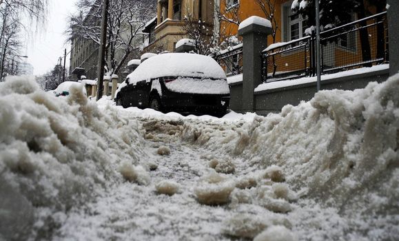 Low angle of view of lot of snow on the street