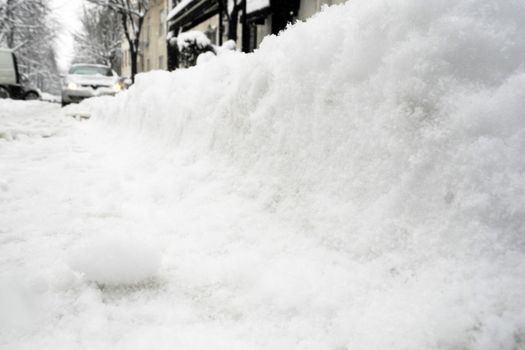 Low angle of view of lot of snow on the street