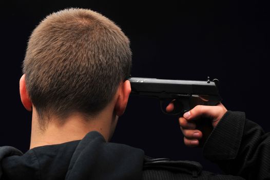 Young man trying to commit suicide with gun