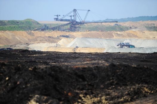 View on large surface coal mine on sunny day