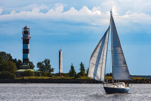 Blue sailboat in the travel by Europe. Sea journey