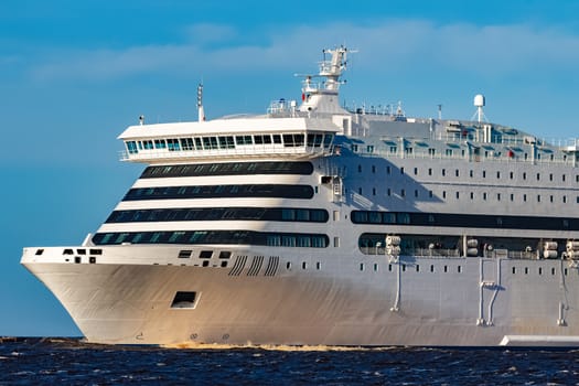 White cruise liner sailing on a clear day