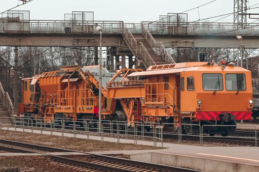 Ballast distributing and profiling track machine. Repair train