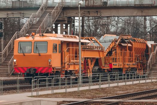 Ballast distributing and profiling track machine. Repair train