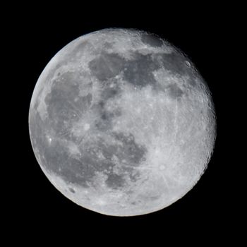 Photos of the full moon in the night sky.