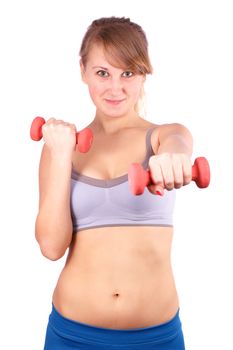 The girl goes in for sports with dumbbells on a white background.