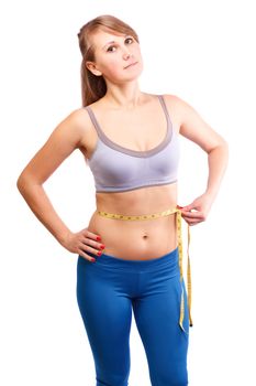 Girl after exercise meter measures your waist on a white  background.