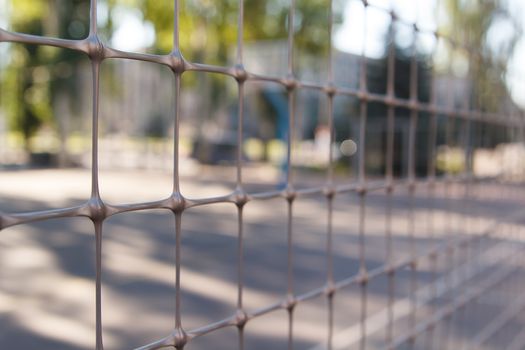 Rusty old armored fence. The small depth of field.