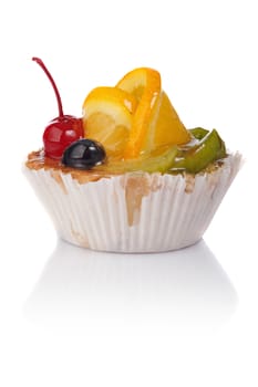 Delicious cake with orange and cherry on a white background.