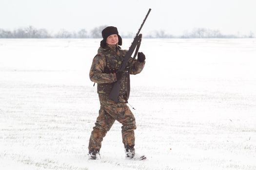 The hunter on winter hunting hare.