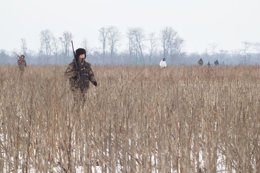 The hunter on winter hunting hare.