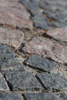 Photo of the old, dark stone pavement.