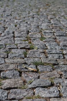 Photo of the old, dark stone pavement.