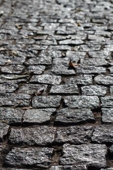 Photo of the old, dark stone pavement.